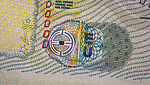 Close-Up of KINEGRAM ZERO point ZERO security feature on EU Visa showing an EU logo and a fine-line guilloche design