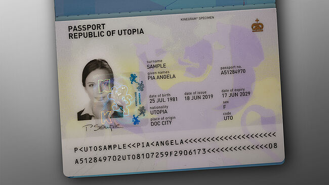 Image of polycarbonate passport datapage secured by embedded KINEGRAM PRIME feature showing printed and metallized lines in perfect register