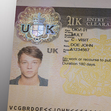 Illustration of UK Visa which is secured by a metallized KINEGRAM patch that contains intricate guilloche details..