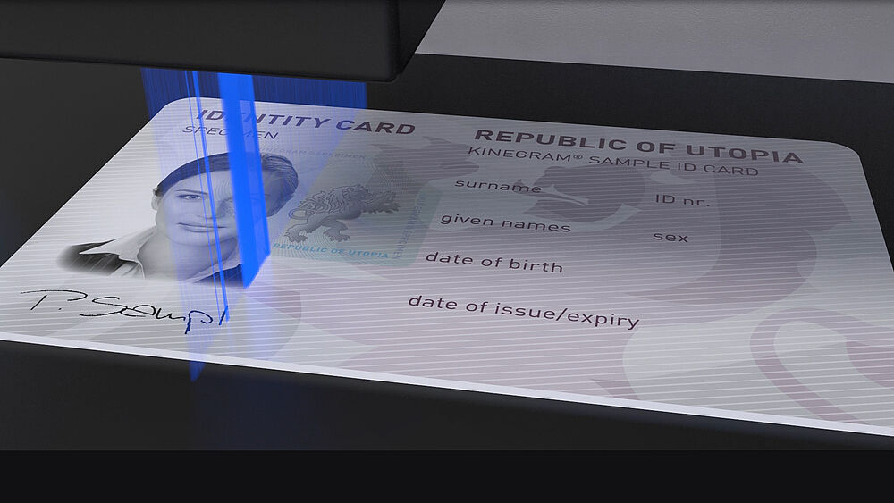 Consultancy services on document security, personalization, verification Image of blue laser ray personalizing an ID card