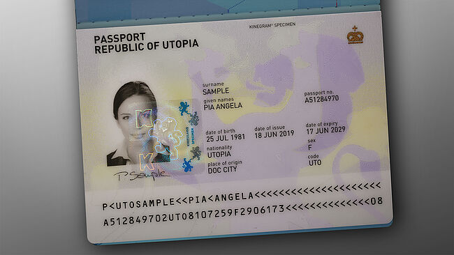 Image of sample passport with a KINEGRAM showing two lions, connected at their legs.