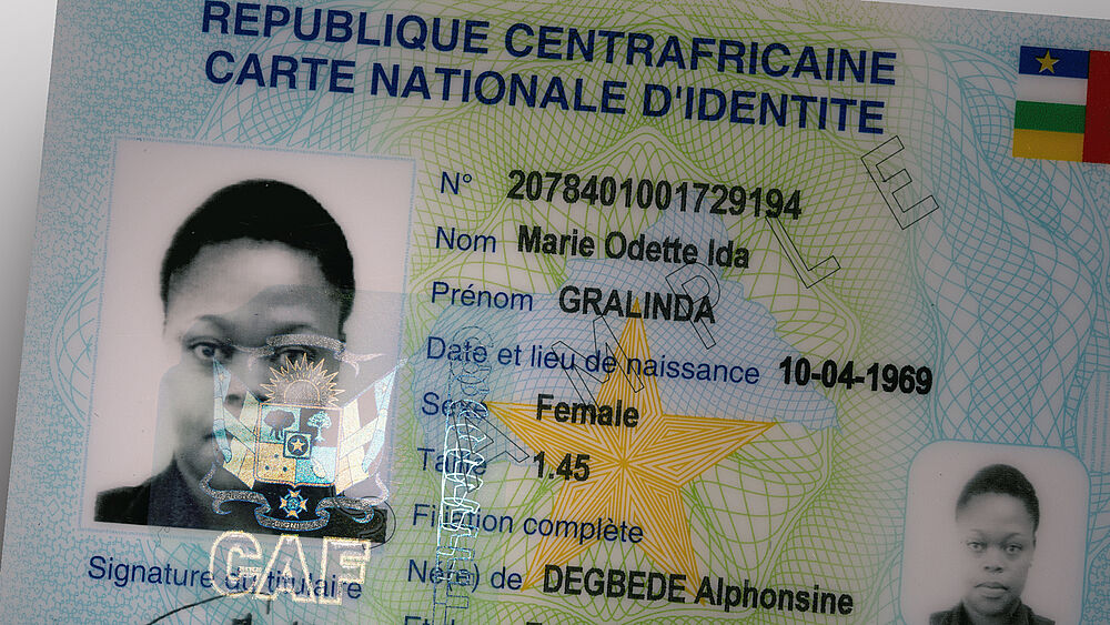 KINEGRAM features are suitable for polycarbonate, paper and any other kind of substrate Close-Up of KINEGRAM security feature on a Central African identity document, with a design of the country's coat of arms