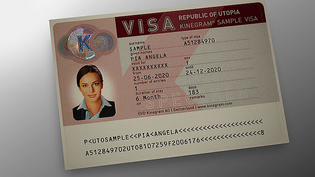 Image of KINEGRAM sample security patch for protecting visa stickers showing a circular design combining metallized and printed lines