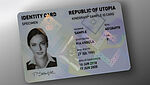 Image of polycarbonate ID card with embedded KINEGRAM security feature showing a diamond-shaped design